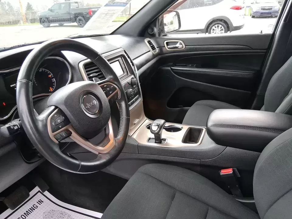 2015 Jeep Grand Cherokee Laredo (1C4RJFAG5FC) with an 3.6L V-6 DOHC engine, 8-Speed Automatic transmission, located at 1099 N County Rd 25A , Troy, OH, 45373, (937) 908-9800, 40.057079, -84.212883 - Need one SUV that can handle school drop-offs in the morning, a smooth I75 commute at lunchtime, and a last-minute weekend escape to the Miami Valley trails? This 2015 Jeep Grand Cherokee Laredo 4WD is built for real life in Troy, Ohio-comfortable enough for daily driving, confident enough for unpre - Photo#9