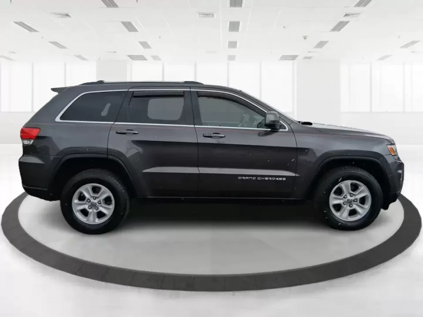 2015 Jeep Grand Cherokee Laredo (1C4RJFAG5FC) with an 3.6L V-6 DOHC engine, 8-Speed Automatic transmission, located at 1951 S Dayton Lakeview Rd., New Carlisle, OH, 45344, (937) 908-9800, 39.890999, -84.050255 - Need one SUV that can handle school drop-offs in the morning, a smooth I75 commute at lunchtime, and a last-minute weekend escape to the Miami Valley trails? This 2015 Jeep Grand Cherokee Laredo 4WD is built for real life in Troy, Ohio-comfortable enough for daily driving, confident enough for unpre - Photo#1