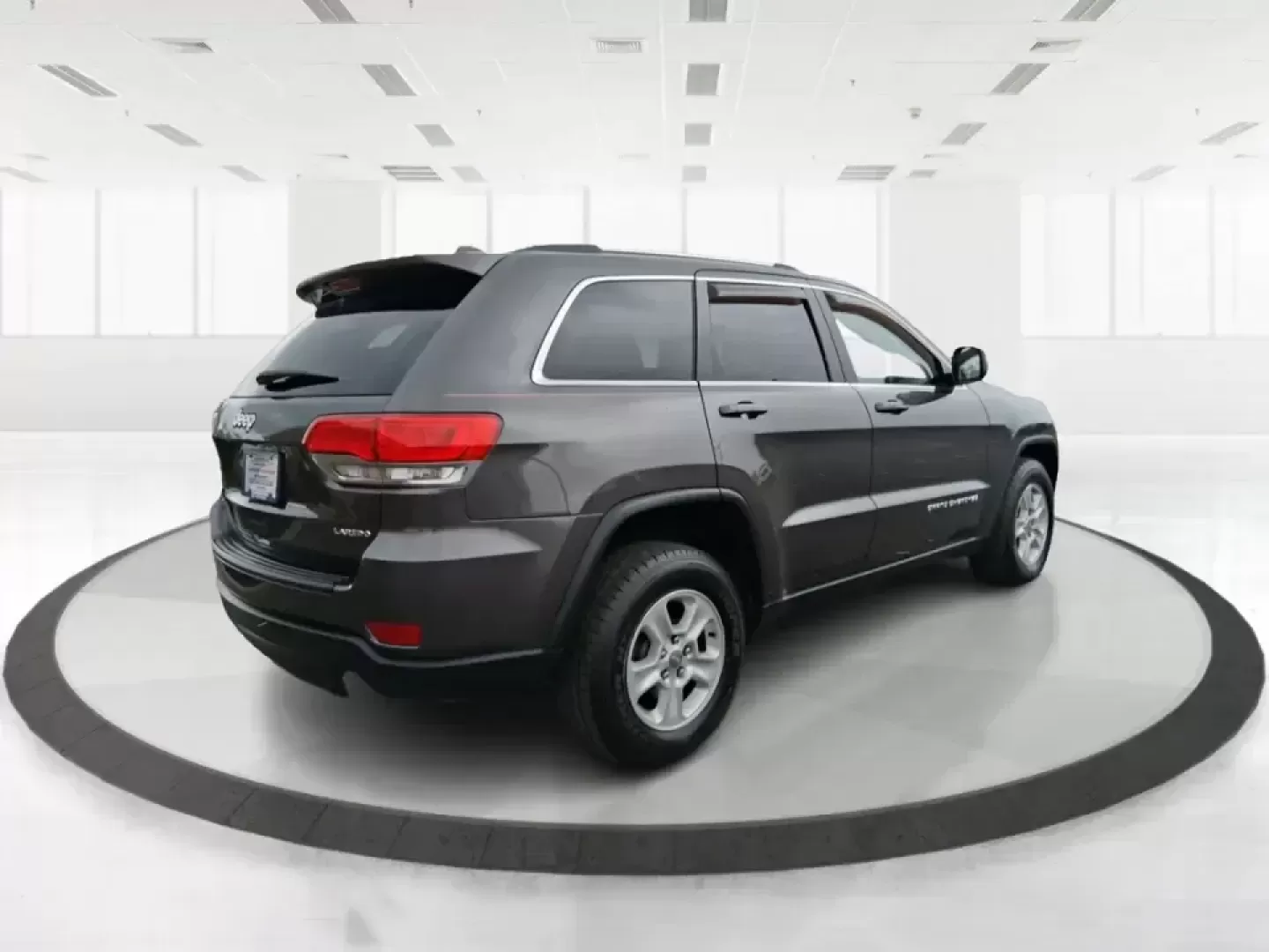 2015 Jeep Grand Cherokee Laredo (1C4RJFAG5FC) with an 3.6L V-6 DOHC engine, 8-Speed Automatic transmission, located at 1951 S Dayton Lakeview Rd., New Carlisle, OH, 45344, (937) 908-9800, 39.890999, -84.050255 - Need one SUV that can handle school drop-offs in the morning, a smooth I75 commute at lunchtime, and a last-minute weekend escape to the Miami Valley trails? This 2015 Jeep Grand Cherokee Laredo 4WD is built for real life in Troy, Ohio-comfortable enough for daily driving, confident enough for unpre - Photo#2