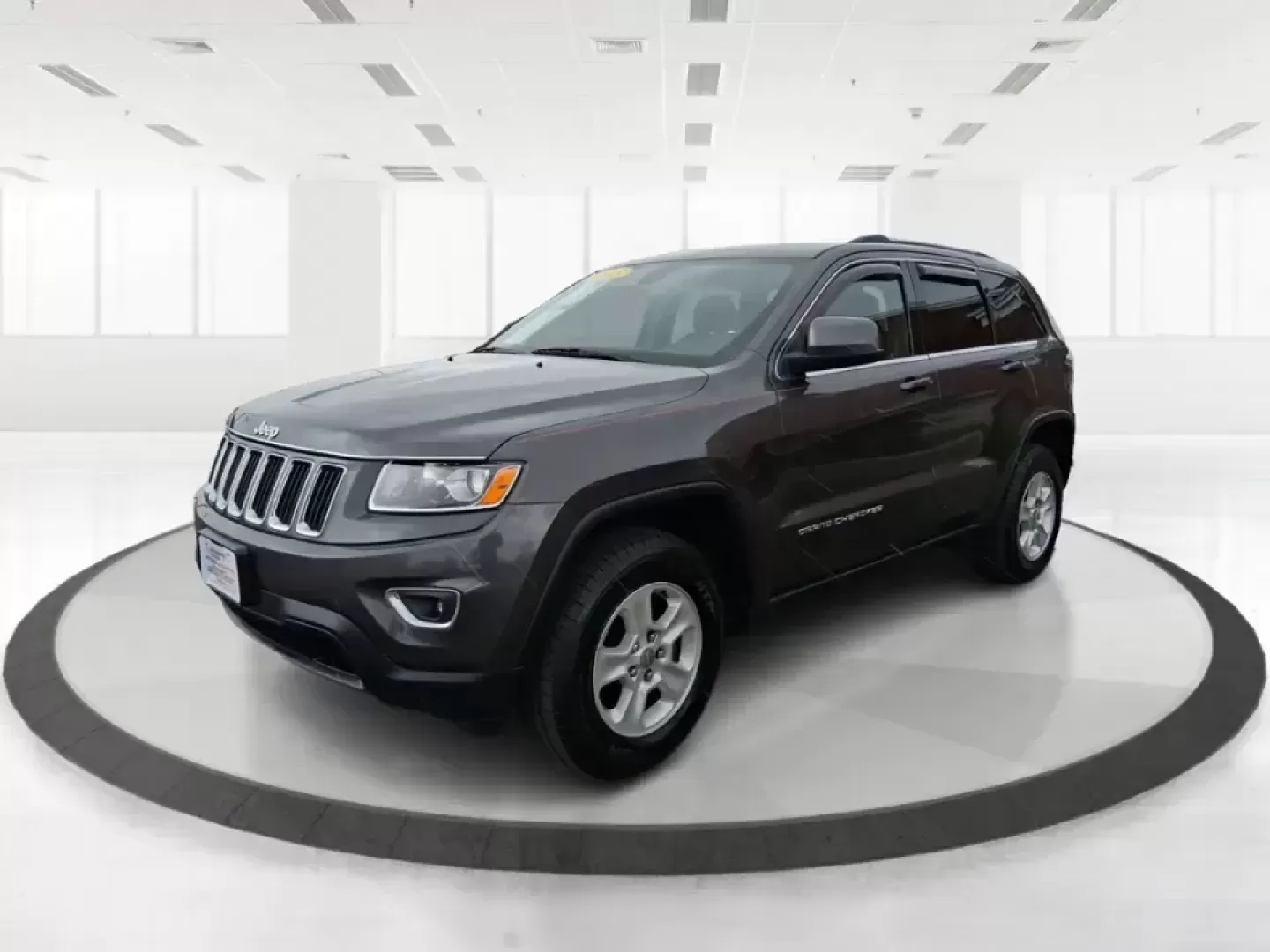 2015 Jeep Grand Cherokee Laredo (1C4RJFAG5FC) with an 3.6L V-6 DOHC engine, 8-Speed Automatic transmission, located at 1951 S Dayton Lakeview Rd., New Carlisle, OH, 45344, (937) 908-9800, 39.890999, -84.050255 - Need one SUV that can handle school drop-offs in the morning, a smooth I75 commute at lunchtime, and a last-minute weekend escape to the Miami Valley trails? This 2015 Jeep Grand Cherokee Laredo 4WD is built for real life in Troy, Ohio-comfortable enough for daily driving, confident enough for unpre - Photo#8