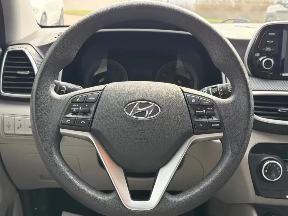 2019 Hyundai Tucson Value (KM8J33A41KU) with an Nu 2L I-4 gasoline direct injection engine, 6A transmission, located at 8750 N County Rd 25A, Piqua, OH, 45356, (937) 908-9800, 40.164391, -84.232513 - Picture your next Ohio weekend: loading up the cooler, tossing sports gear in the back, and cruising from Piqua to a family cookout or a quick getaway-without stressing about space, comfort, or the road ahead. This **2019 Hyundai Tucson Value** in **White Pearl** is the kind of compact SUV that fits - Photo#16