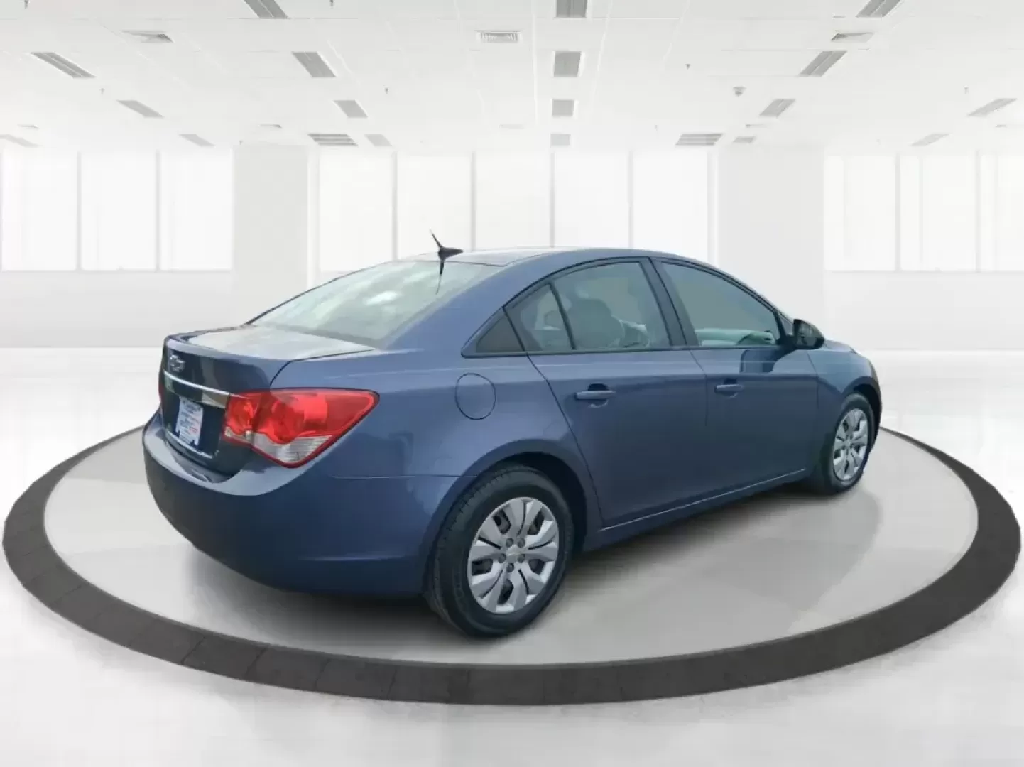 2014 Chevrolet Cruze LS Auto (1G1PA5SG7E7) with an ECOTEC 1.8L I-4 DOHC engine, 6-Speed Automatic transmission, located at 401 Woodman Dr, Riverside, OH, 45431, (937) 908-9800, 39.760899, -84.123421 - Picture a dependable daily commuter that still feels comfortable for weekend errands, school drop-offs, and the occasional road trip down I-675 or US-35-this 2014 Chevrolet Cruze LS Auto is the kind of practical sedan that fits real life in the Dayton area. Finished in Atlantis Blue Metallic, it's e - Photo#2
