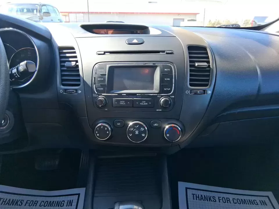 2016 Kia Forte LX (KNAFX4A63G5) with an 1.8L I-4 DOHC engine, 6-Speed Automatic transmission, located at 1184 Kauffman Ave, Fairborn, OH, 45324, (937) 908-9800, 39.807072, -84.030914 - Need a dependable commuter that still feels comfortable for weekend plans around the Miami Valley? This **2016 Kia Forte LX** in **Steel Blue Metallic** is a smart, budget-friendly sedan that fits real life in **Fairborn, Ohio**-whether you're driving to Wright-Patterson AFB, heading to class, or cr - Photo#13