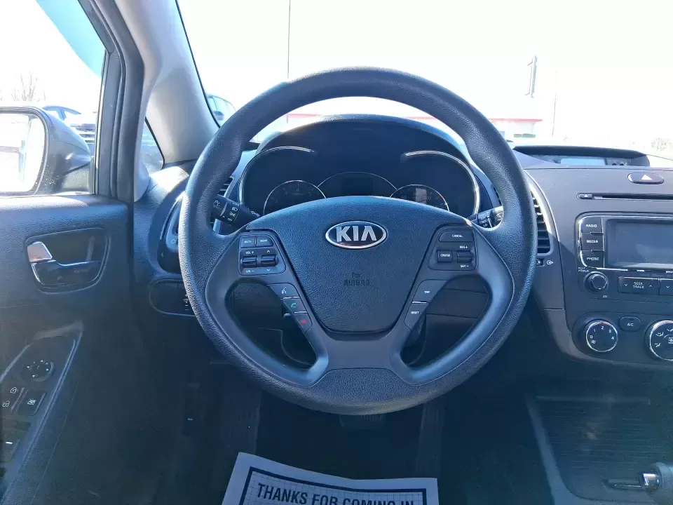 2016 Kia Forte LX (KNAFX4A63G5) with an 1.8L I-4 DOHC engine, 6-Speed Automatic transmission, located at 1184 Kauffman Ave, Fairborn, OH, 45324, (937) 908-9800, 39.807072, -84.030914 - Need a dependable commuter that still feels comfortable for weekend plans around the Miami Valley? This **2016 Kia Forte LX** in **Steel Blue Metallic** is a smart, budget-friendly sedan that fits real life in **Fairborn, Ohio**-whether you're driving to Wright-Patterson AFB, heading to class, or cr - Photo#16