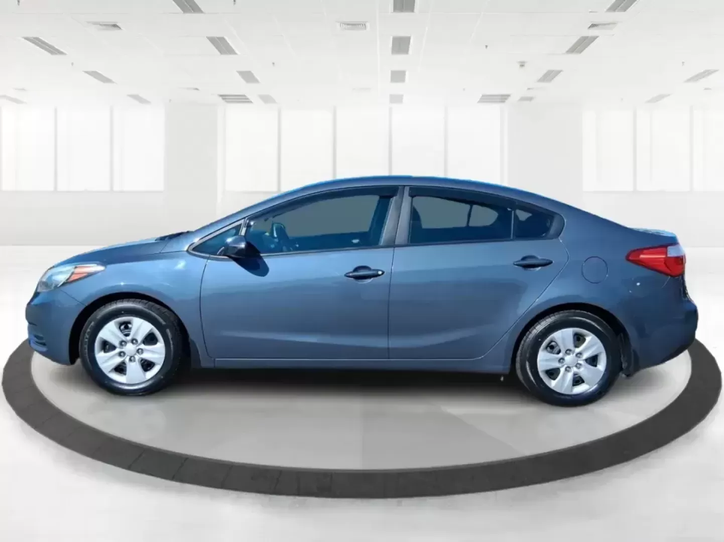 2016 Kia Forte LX (KNAFX4A63G5) with an 1.8L I-4 DOHC engine, 6-Speed Automatic transmission, located at 1951 S Dayton Lakeview Rd., New Carlisle, OH, 45344, (937) 908-9800, 39.890999, -84.050255 - Need a dependable commuter that still feels comfortable for weekend plans around the Miami Valley? This **2016 Kia Forte LX** in **Steel Blue Metallic** is a smart, budget-friendly sedan that fits real life in **Fairborn, Ohio**-whether you're driving to Wright-Patterson AFB, heading to class, or cr - Photo#5