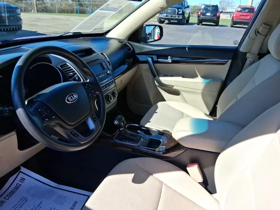 2015 Kia Sorento LX (5XYKTCA67FG) with an 2.4L I-4 gasoline direct injection engine, 6-Speed Automatic transmission, located at 1951 S Dayton Lakeview Rd., New Carlisle, OH, 45344, (937) 908-9800, 39.890999, -84.050255 - Weekend road trips to John Bryan State Park, busy school mornings, or a long commute down I70-this 2015 Kia Sorento LX is the kind of SUV that fits real life in the Miami Valley. Finished in eye-catching Remington Red Metallic, it's a practical, confidence-inspiring choice for growing families, outd - Photo#9