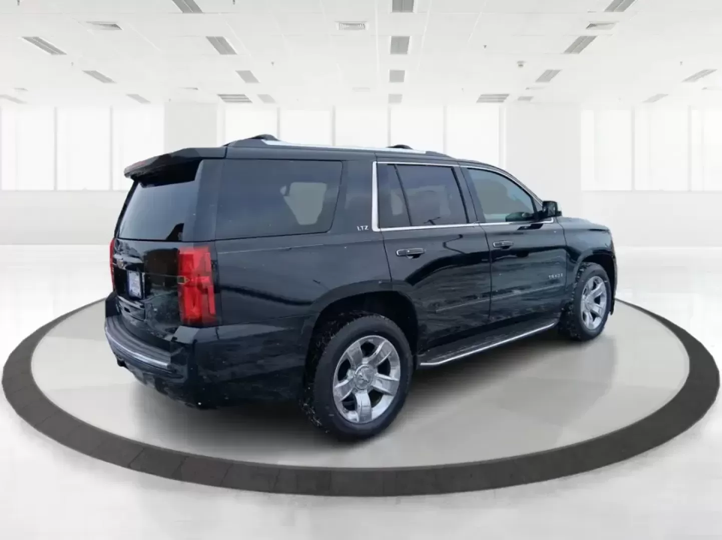 2015 Chevrolet Tahoe LTZ (1GNSKCKC9FR) with an EcoTec3 5.3L V-8 gasoline direct injection engine, 6-Speed Automatic transmission, located at 4508 South Dixie Dr, Moraine, OH, 45439, (937) 908-9800, 39.689976, -84.218452 - Big family weekend at Indian Lake, a road-trip up I-75, or a daily commute with room for coworkers and gear-this 2015 Chevrolet Tahoe LTZ 4WD is built for the kind of life that doesn't fit in a small SUV. Finished in sleek Black and powered by the EcoTec3 5.3L V8 with a smooth 6-speed automatic tran - Photo#2