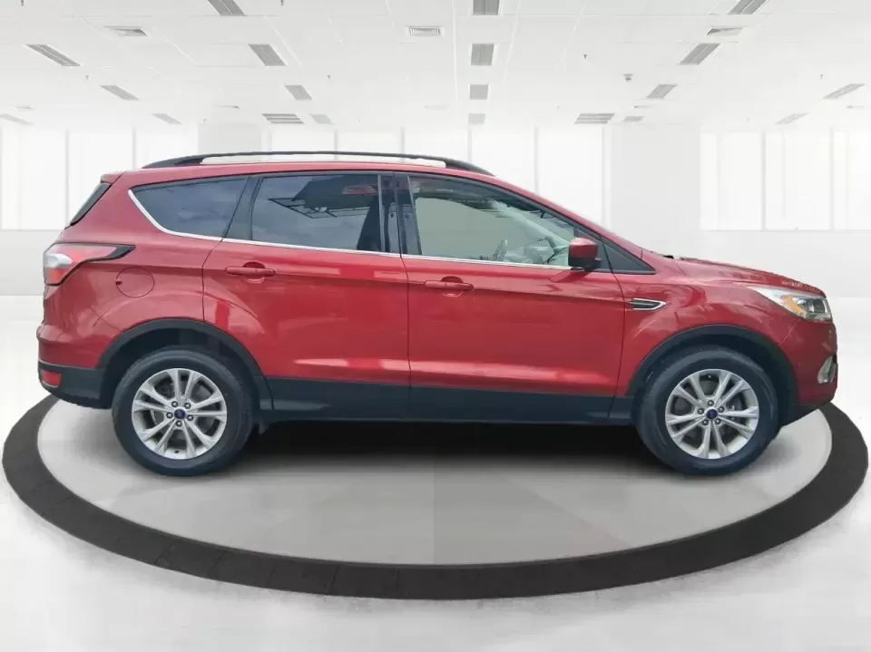 2018 Ford Escape SEL (1FMCU9HD2JU) with an 1.5L L4 DOHC 16V engine, 6A transmission, located at 401 Woodman Dr, Riverside, OH, 45431, (937) 908-9800, 39.760899, -84.123421 - Need a do-it-all SUV that can handle the weekday commute on I-675, quick school drop-offs near Wright-Patterson AFB, and spontaneous weekend getaways to Carillon Historical Park or a lap around Eastwood MetroPark? This 2018 Ford Escape SEL in Ruby Red Metallic Tinted Clearcoat is built for real-life - Photo#1