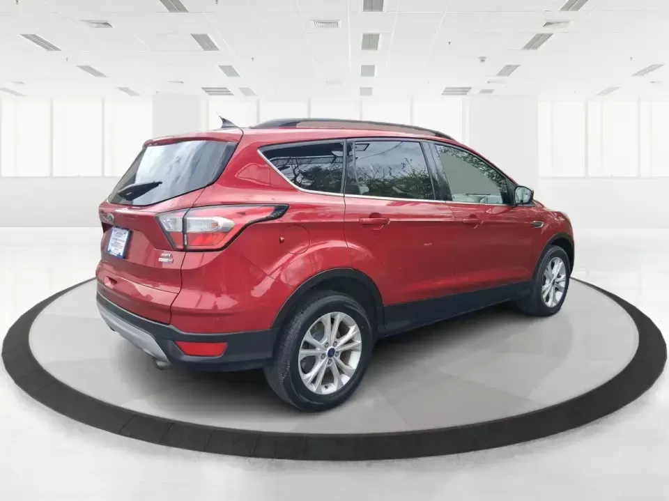 2018 Ford Escape SEL (1FMCU9HD2JU) with an 1.5L L4 DOHC 16V engine, 6A transmission, located at 401 Woodman Dr, Riverside, OH, 45431, (937) 908-9800, 39.760899, -84.123421 - Need a do-it-all SUV that can handle the weekday commute on I-675, quick school drop-offs near Wright-Patterson AFB, and spontaneous weekend getaways to Carillon Historical Park or a lap around Eastwood MetroPark? This 2018 Ford Escape SEL in Ruby Red Metallic Tinted Clearcoat is built for real-life - Photo#2