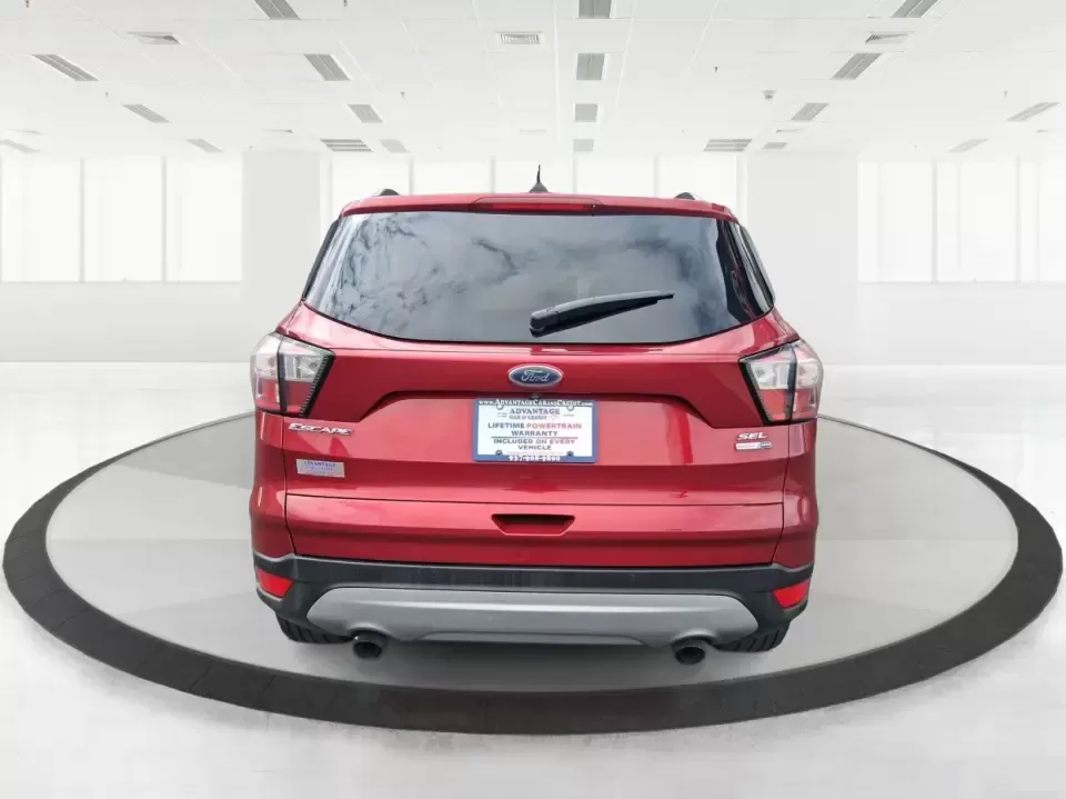 2018 Ford Escape SEL (1FMCU9HD2JU) with an 1.5L L4 DOHC 16V engine, 6A transmission, located at 401 Woodman Dr, Riverside, OH, 45431, (937) 908-9800, 39.760899, -84.123421 - Need a do-it-all SUV that can handle the weekday commute on I-675, quick school drop-offs near Wright-Patterson AFB, and spontaneous weekend getaways to Carillon Historical Park or a lap around Eastwood MetroPark? This 2018 Ford Escape SEL in Ruby Red Metallic Tinted Clearcoat is built for real-life - Photo#3