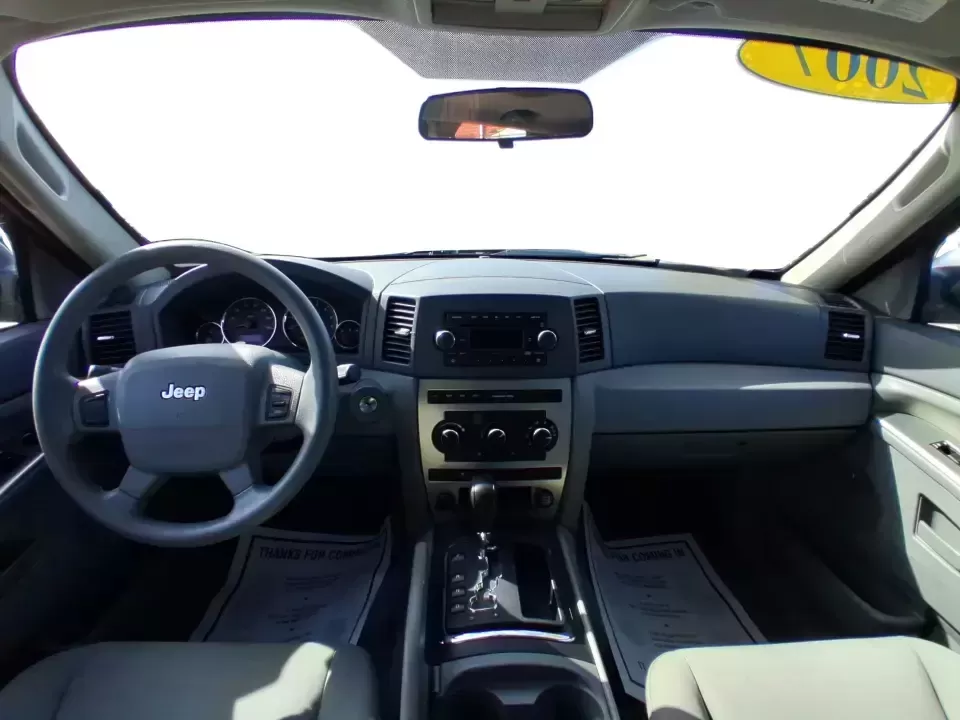 2007 Jeep Grand Cherokee Laredo (1J8GR48K47C) with an 3.7L V6 SOHC 12V engine, 5-Speed Automatic Overdrive transmission, located at 880 E. National Road, Vandalia, OH, 45377, (937) 908-9800, 39.891918, -84.183594 - Weekend getaways to the trails, winter commutes on slick Ohio roads, and family errands across town all get easier when you're in a capable SUV with true 4WD confidence. This **2007 Jeep Grand Cherokee Laredo** is built for drivers who want classic Jeep utility without giving up everyday comfort-ide - Photo#20