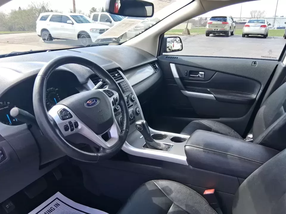 2013 Ford Edge SEL (2FMDK4JC3DB) with an 3.5L V-6 DOHC engine, 6-Speed Automatic transmission, located at 1099 N County Rd 25A , Troy, OH, 45373, (937) 908-9800, 40.057079, -84.212883 - Pack up the kids, cue up your favorite playlist, and point the nose toward a weekend getaway-this 2013 Ford Edge SEL is the kind of comfortable, confident SUV that fits real life in Troy, Ohio. Whether you're commuting up SR-25A, running after-school errands near downtown Troy, or loading up for a r - Photo#9