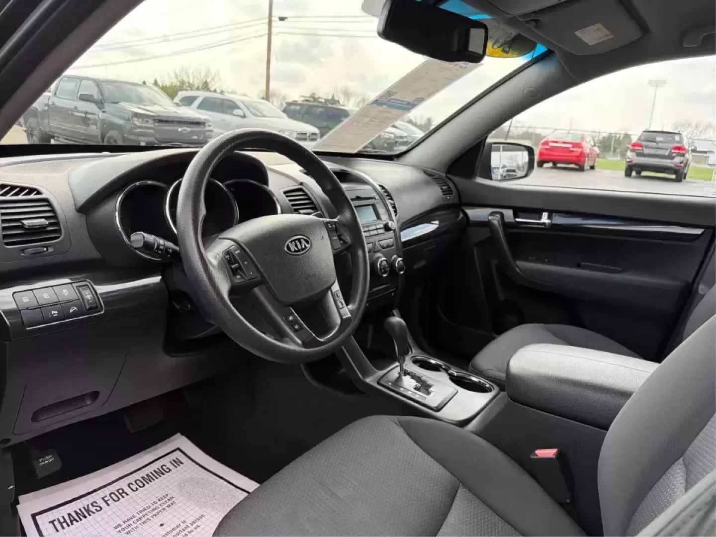 2012 Kia Sorento LX (5XYKT3A68CG) with an 2.4L I-4 gasoline direct injection engine, 6-Speed Automatic transmission, located at 1230 East Main St, Xenia, OH, 45385, (937) 908-9800, 39.688026, -83.910172 - Weekend getaways to John Bryan State Park, daily school drop-offs around Xenia, or an easy commute toward Beavercreek and Dayton-this Ebony Black 2012 Kia Sorento LX is the kind of SUV that fits real life. With practical space, confident road manners, and comfort features you'll appreciate on longer - Photo#9