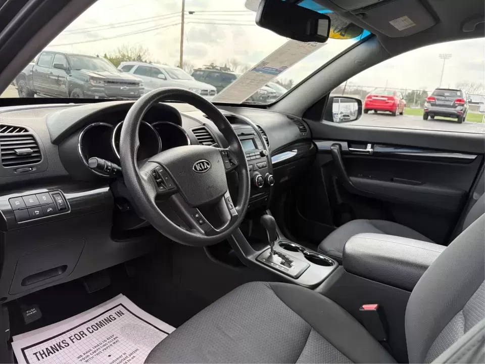 2012 Kia Sorento LX (5XYKT3A68CG) with an 2.4L I-4 gasoline direct injection engine, 6-Speed Automatic transmission, located at 1230 East Main St, Xenia, OH, 45385, (937) 908-9800, 39.688026, -83.910172 - Weekend getaways to John Bryan State Park, daily school drop-offs around Xenia, or an easy commute toward Beavercreek and Dayton-this Ebony Black 2012 Kia Sorento LX is the kind of SUV that fits real life. With practical space, confident road manners, and comfort features you'll appreciate on longer - Photo#9