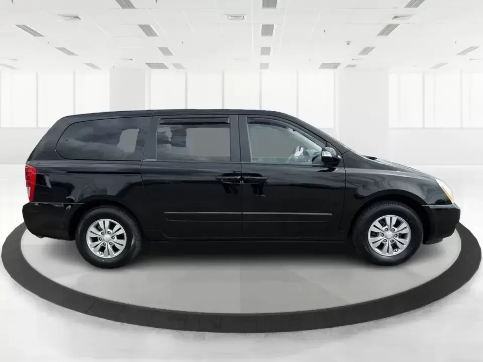 2012 Kia Sedona LX (KNDMG4C78C6) with an 3.5L V-6 DOHC engine, 5-Speed Automatic transmission, located at 401 Woodman Dr, Riverside, OH, 45431, (937) 908-9800, 39.760899, -84.123421 - Picture the next family road trip, soccer Saturday, or airport pickup where everyone actually fits comfortably-plus there's room left for groceries, strollers, and weekend gear. This 2012 Kia Sedona LX in Aurora Black is built for real life: school drop-offs, long commutes across the Miami Valley, a - Photo#1