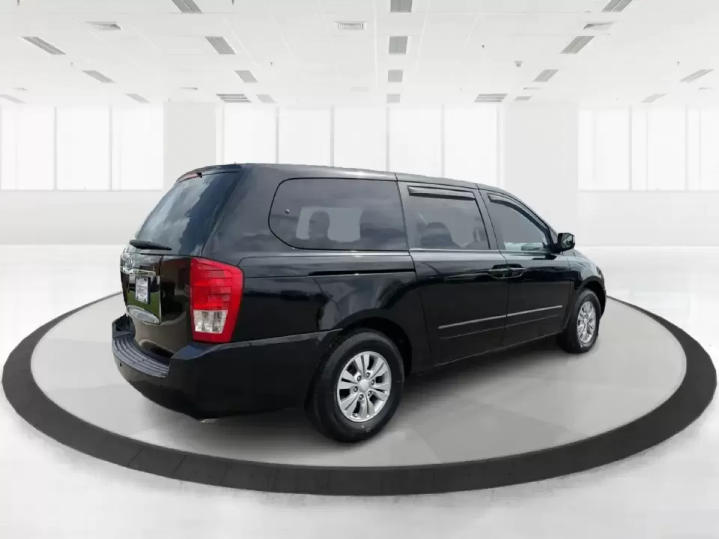 2012 Kia Sedona LX (KNDMG4C78C6) with an 3.5L V-6 DOHC engine, 5-Speed Automatic transmission, located at 1184 Kauffman Ave, Fairborn, OH, 45324, (937) 908-9800, 39.807072, -84.030914 - Picture the next family road trip, soccer Saturday, or airport pickup where everyone actually fits comfortably-plus there's room left for groceries, strollers, and weekend gear. This 2012 Kia Sedona LX in Aurora Black is built for real life: school drop-offs, long commutes across the Miami Valley, a - Photo#2