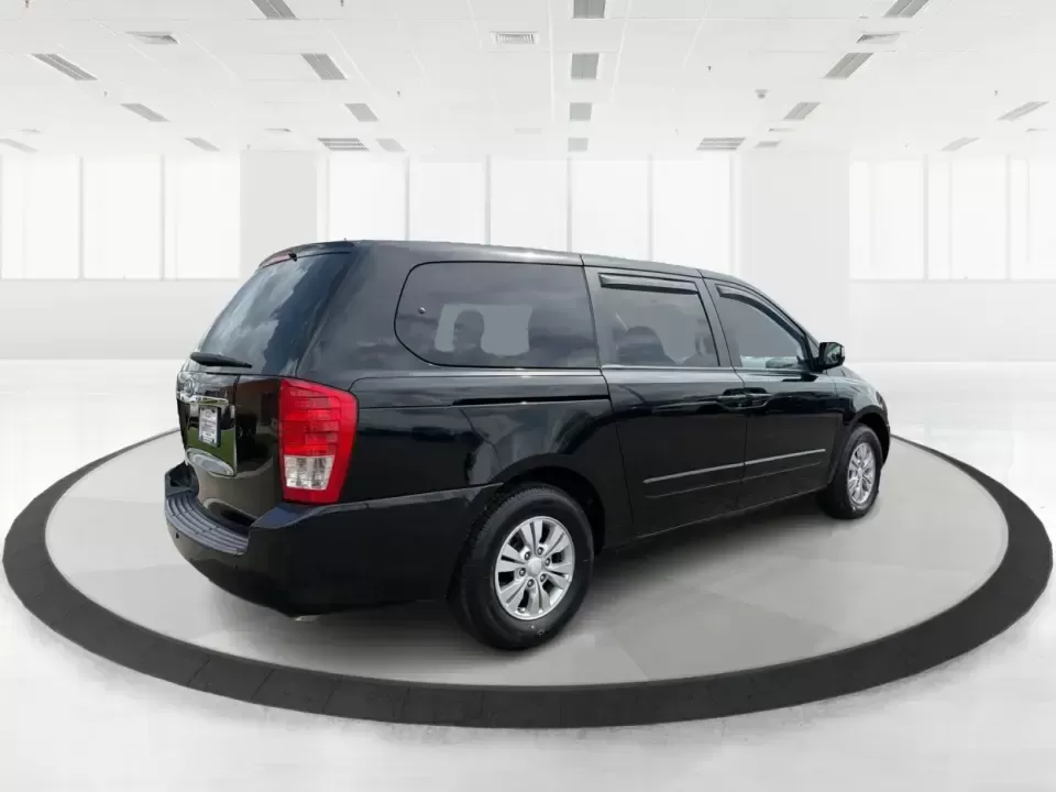 2012 Kia Sedona LX (KNDMG4C78C6) with an 3.5L V-6 DOHC engine, 5-Speed Automatic transmission, located at 401 Woodman Dr, Riverside, OH, 45431, (937) 908-9800, 39.760899, -84.123421 - Picture the next family road trip, soccer Saturday, or airport pickup where everyone actually fits comfortably-plus there's room left for groceries, strollers, and weekend gear. This 2012 Kia Sedona LX in Aurora Black is built for real life: school drop-offs, long commutes across the Miami Valley, a - Photo#2