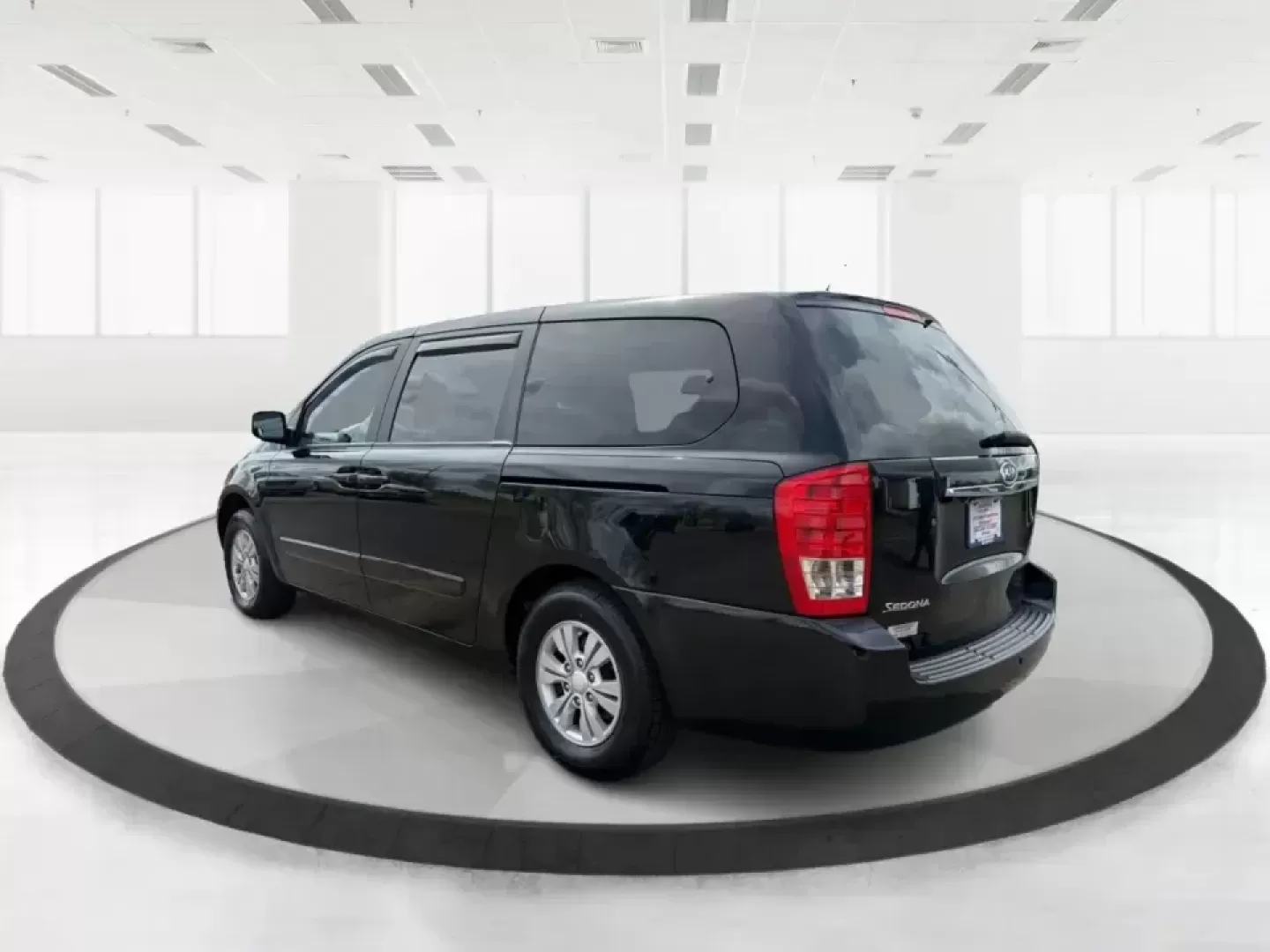 2012 Kia Sedona LX (KNDMG4C78C6) with an 3.5L V-6 DOHC engine, 5-Speed Automatic transmission, located at 1184 Kauffman Ave, Fairborn, OH, 45324, (937) 908-9800, 39.807072, -84.030914 - Picture the next family road trip, soccer Saturday, or airport pickup where everyone actually fits comfortably-plus there's room left for groceries, strollers, and weekend gear. This 2012 Kia Sedona LX in Aurora Black is built for real life: school drop-offs, long commutes across the Miami Valley, a - Photo#4