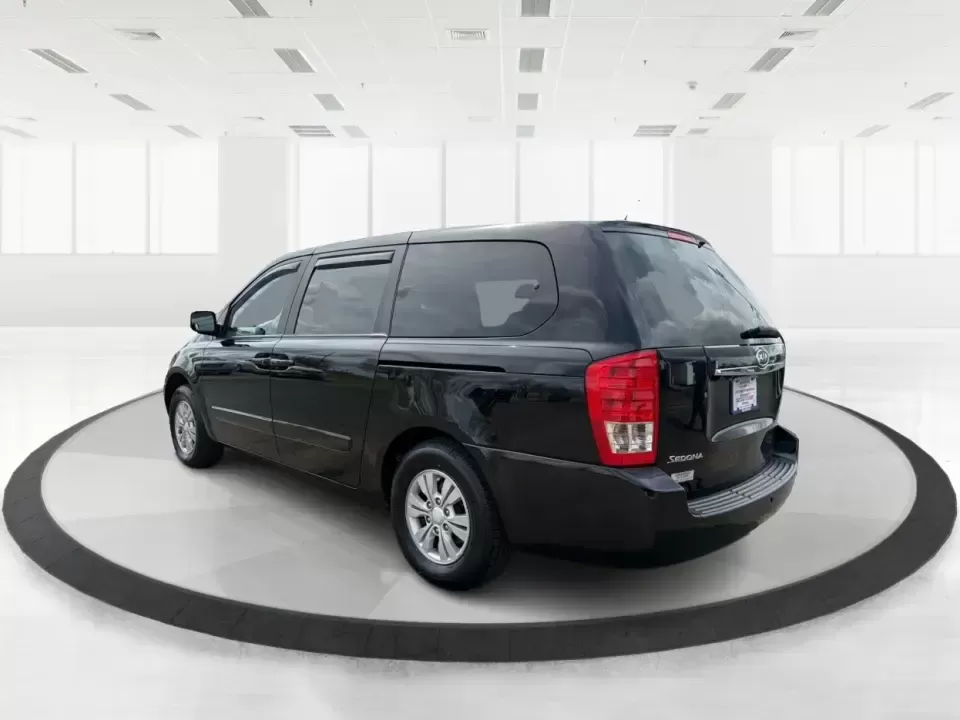 2012 Kia Sedona LX (KNDMG4C78C6) with an 3.5L V-6 DOHC engine, 5-Speed Automatic transmission, located at 401 Woodman Dr, Riverside, OH, 45431, (937) 908-9800, 39.760899, -84.123421 - Picture the next family road trip, soccer Saturday, or airport pickup where everyone actually fits comfortably-plus there's room left for groceries, strollers, and weekend gear. This 2012 Kia Sedona LX in Aurora Black is built for real life: school drop-offs, long commutes across the Miami Valley, a - Photo#4