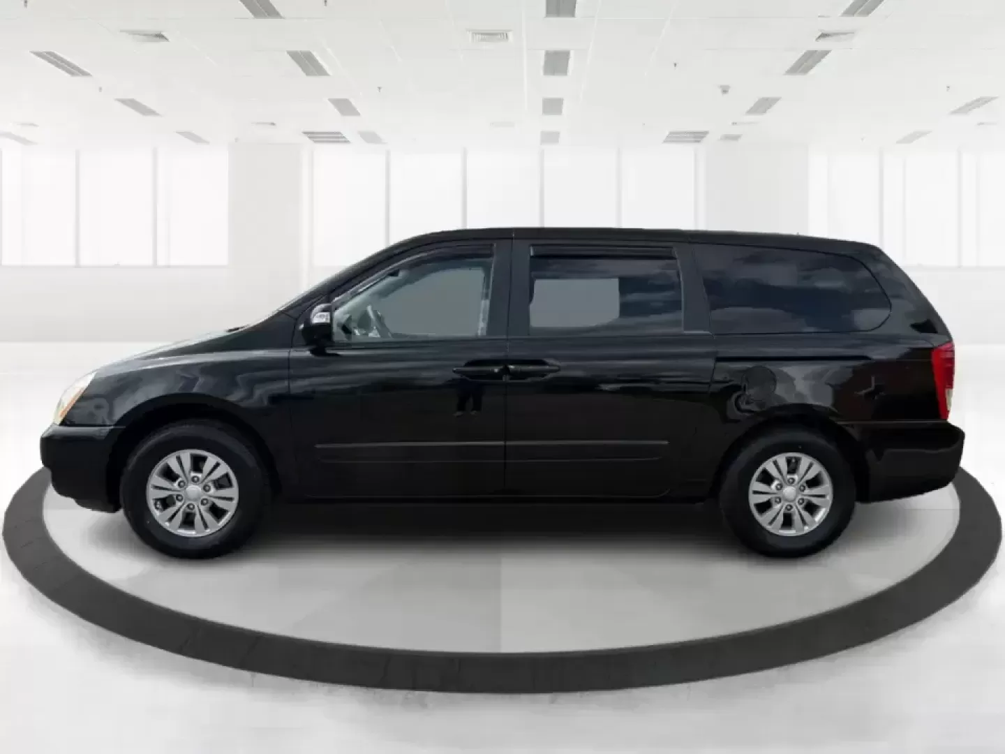 2012 Kia Sedona LX (KNDMG4C78C6) with an 3.5L V-6 DOHC engine, 5-Speed Automatic transmission, located at 1184 Kauffman Ave, Fairborn, OH, 45324, (937) 908-9800, 39.807072, -84.030914 - Picture the next family road trip, soccer Saturday, or airport pickup where everyone actually fits comfortably-plus there's room left for groceries, strollers, and weekend gear. This 2012 Kia Sedona LX in Aurora Black is built for real life: school drop-offs, long commutes across the Miami Valley, a - Photo#5