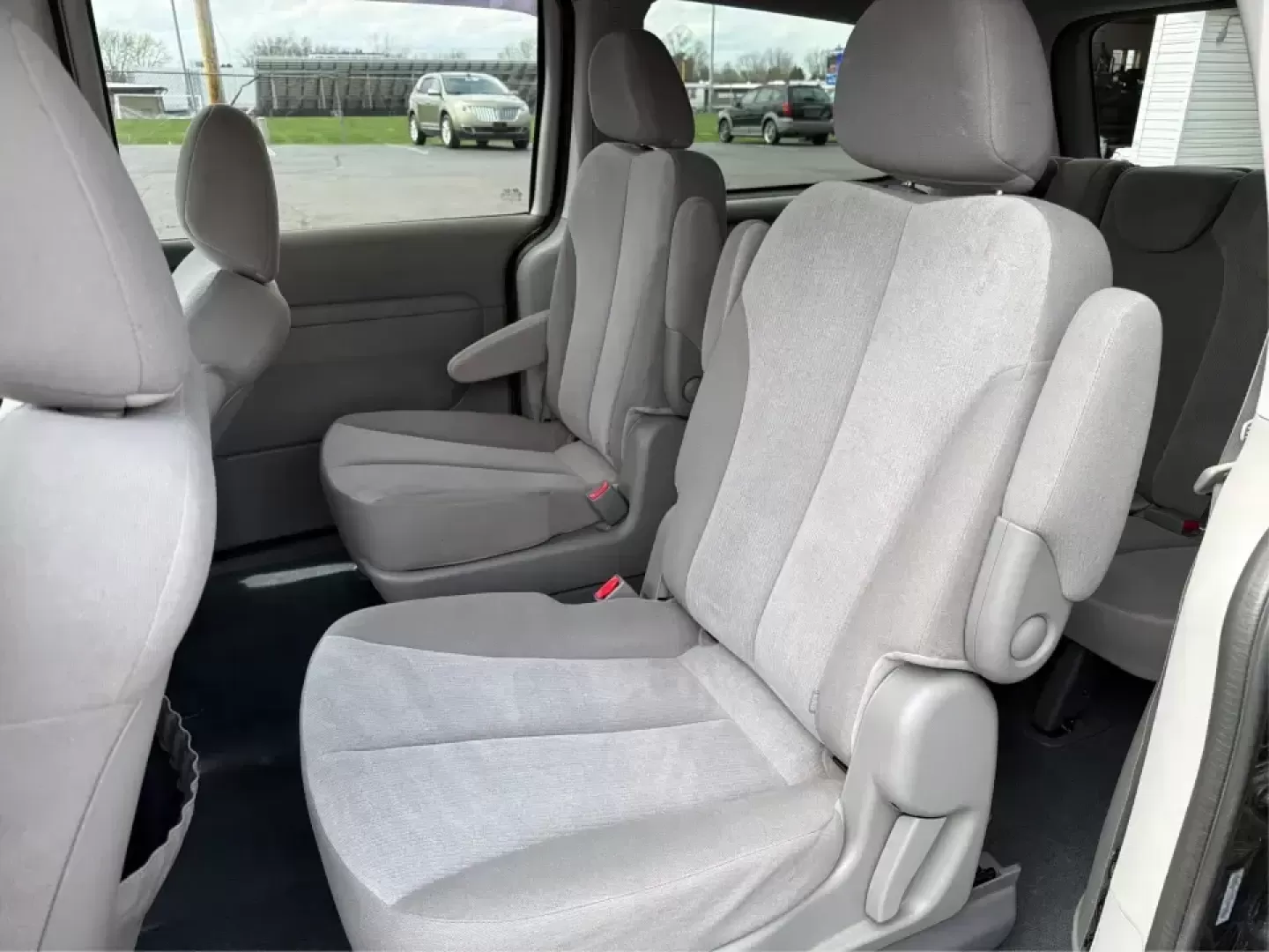 2012 Kia Sedona LX (KNDMG4C78C6) with an 3.5L V-6 DOHC engine, 5-Speed Automatic transmission, located at 1184 Kauffman Ave, Fairborn, OH, 45324, (937) 908-9800, 39.807072, -84.030914 - Picture the next family road trip, soccer Saturday, or airport pickup where everyone actually fits comfortably-plus there's room left for groceries, strollers, and weekend gear. This 2012 Kia Sedona LX in Aurora Black is built for real life: school drop-offs, long commutes across the Miami Valley, a - Photo#10