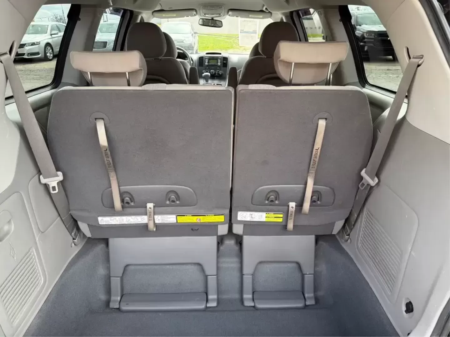 2012 Kia Sedona LX (KNDMG4C78C6) with an 3.5L V-6 DOHC engine, 5-Speed Automatic transmission, located at 1184 Kauffman Ave, Fairborn, OH, 45324, (937) 908-9800, 39.807072, -84.030914 - Picture the next family road trip, soccer Saturday, or airport pickup where everyone actually fits comfortably-plus there's room left for groceries, strollers, and weekend gear. This 2012 Kia Sedona LX in Aurora Black is built for real life: school drop-offs, long commutes across the Miami Valley, a - Photo#12