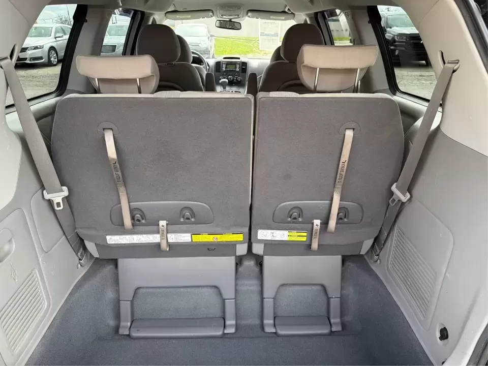 2012 Kia Sedona LX (KNDMG4C78C6) with an 3.5L V-6 DOHC engine, 5-Speed Automatic transmission, located at 401 Woodman Dr, Riverside, OH, 45431, (937) 908-9800, 39.760899, -84.123421 - Picture the next family road trip, soccer Saturday, or airport pickup where everyone actually fits comfortably-plus there's room left for groceries, strollers, and weekend gear. This 2012 Kia Sedona LX in Aurora Black is built for real life: school drop-offs, long commutes across the Miami Valley, a - Photo#12