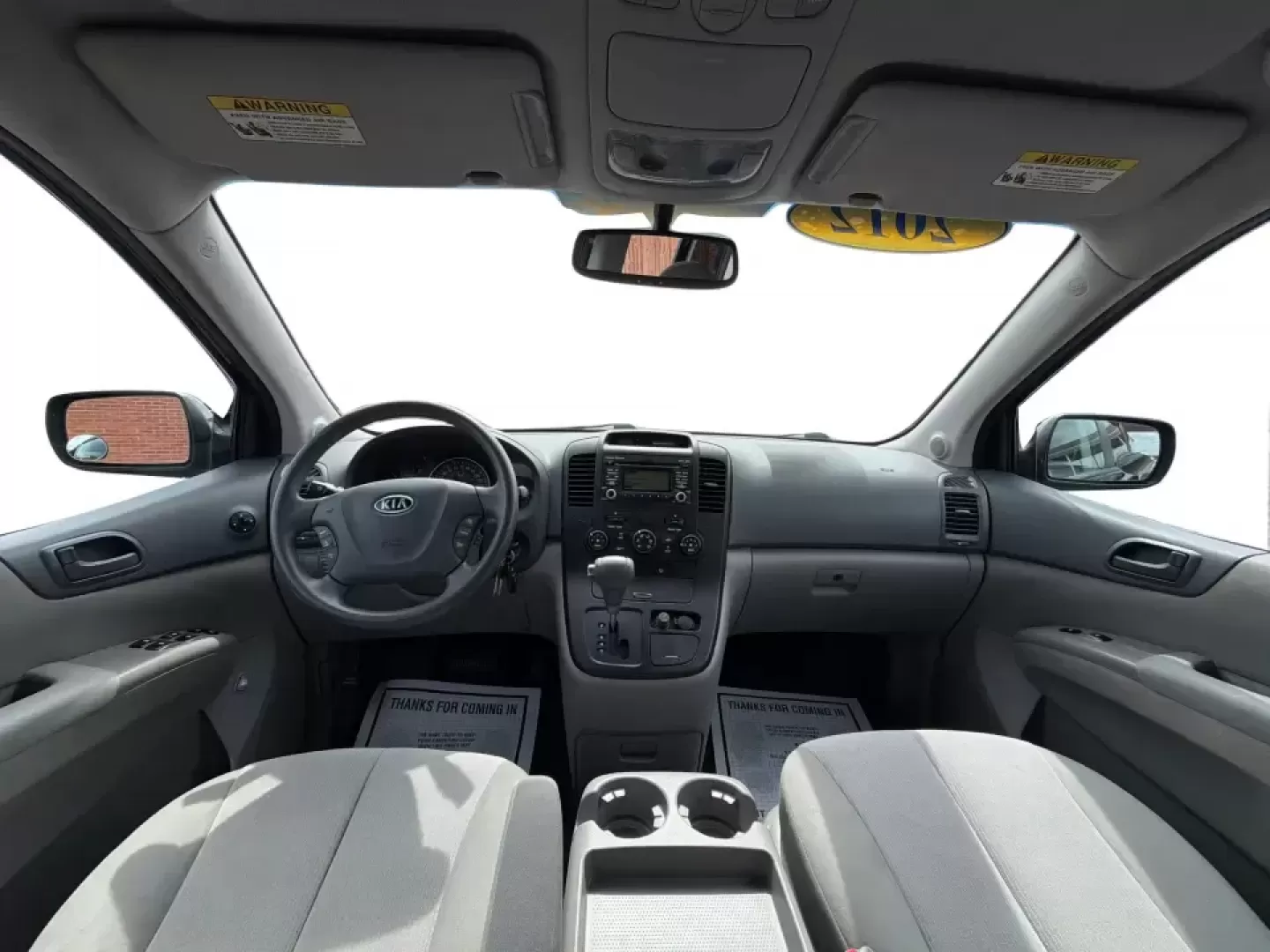 2012 Kia Sedona LX (KNDMG4C78C6) with an 3.5L V-6 DOHC engine, 5-Speed Automatic transmission, located at 1184 Kauffman Ave, Fairborn, OH, 45324, (937) 908-9800, 39.807072, -84.030914 - Picture the next family road trip, soccer Saturday, or airport pickup where everyone actually fits comfortably-plus there's room left for groceries, strollers, and weekend gear. This 2012 Kia Sedona LX in Aurora Black is built for real life: school drop-offs, long commutes across the Miami Valley, a - Photo#19