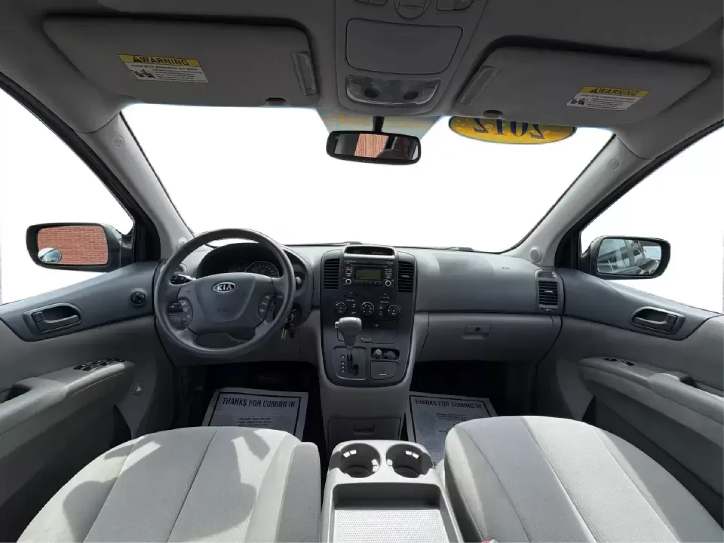 2012 Kia Sedona LX (KNDMG4C78C6) with an 3.5L V-6 DOHC engine, 5-Speed Automatic transmission, located at 1184 Kauffman Ave, Fairborn, OH, 45324, (937) 908-9800, 39.807072, -84.030914 - Picture the next family road trip, soccer Saturday, or airport pickup where everyone actually fits comfortably-plus there's room left for groceries, strollers, and weekend gear. This 2012 Kia Sedona LX in Aurora Black is built for real life: school drop-offs, long commutes across the Miami Valley, a - Photo#20