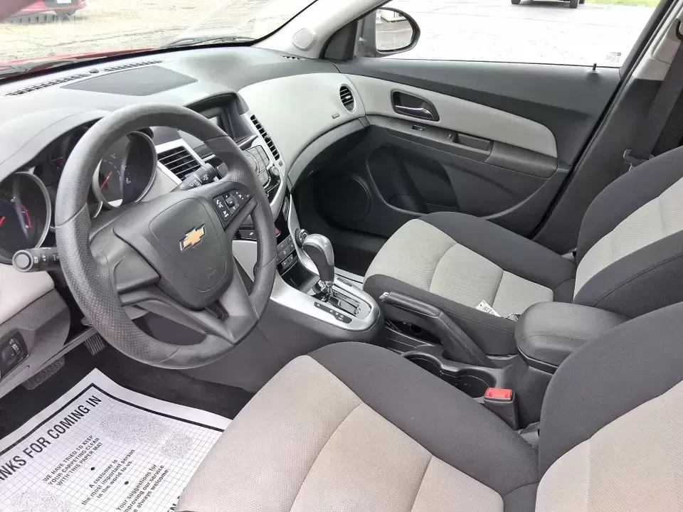 2015 Chevrolet Cruze LS Auto (1G1PA5SG9F7) with an ECOTEC 1.8L I-4 DOHC engine, 6-Speed Automatic transmission, located at 8750 N County Rd 25A, Piqua, OH, 45356, (937) 908-9800, 40.164391, -84.232513 - Picture an easy, affordable daily commute that still feels comfortable on I75, quick trips to downtown Piqua for dinner, and weekend errands that don't drain your budget at the pump. This 2015 Chevrolet Cruze LS Auto in eye-catching Red Hot is a smart, practical sedan for commuters, first-time buyer - Photo#9