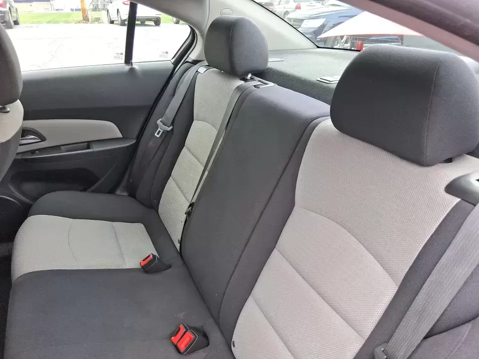 2015 Chevrolet Cruze LS Auto (1G1PA5SG9F7) with an ECOTEC 1.8L I-4 DOHC engine, 6-Speed Automatic transmission, located at 8750 N County Rd 25A, Piqua, OH, 45356, (937) 908-9800, 40.164391, -84.232513 - Picture an easy, affordable daily commute that still feels comfortable on I75, quick trips to downtown Piqua for dinner, and weekend errands that don't drain your budget at the pump. This 2015 Chevrolet Cruze LS Auto in eye-catching Red Hot is a smart, practical sedan for commuters, first-time buyer - Photo#10