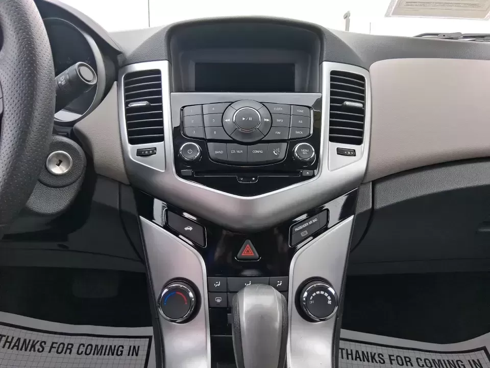 2015 Chevrolet Cruze LS Auto (1G1PA5SG9F7) with an ECOTEC 1.8L I-4 DOHC engine, 6-Speed Automatic transmission, located at 8750 N County Rd 25A, Piqua, OH, 45356, (937) 908-9800, 40.164391, -84.232513 - Picture an easy, affordable daily commute that still feels comfortable on I75, quick trips to downtown Piqua for dinner, and weekend errands that don't drain your budget at the pump. This 2015 Chevrolet Cruze LS Auto in eye-catching Red Hot is a smart, practical sedan for commuters, first-time buyer - Photo#13