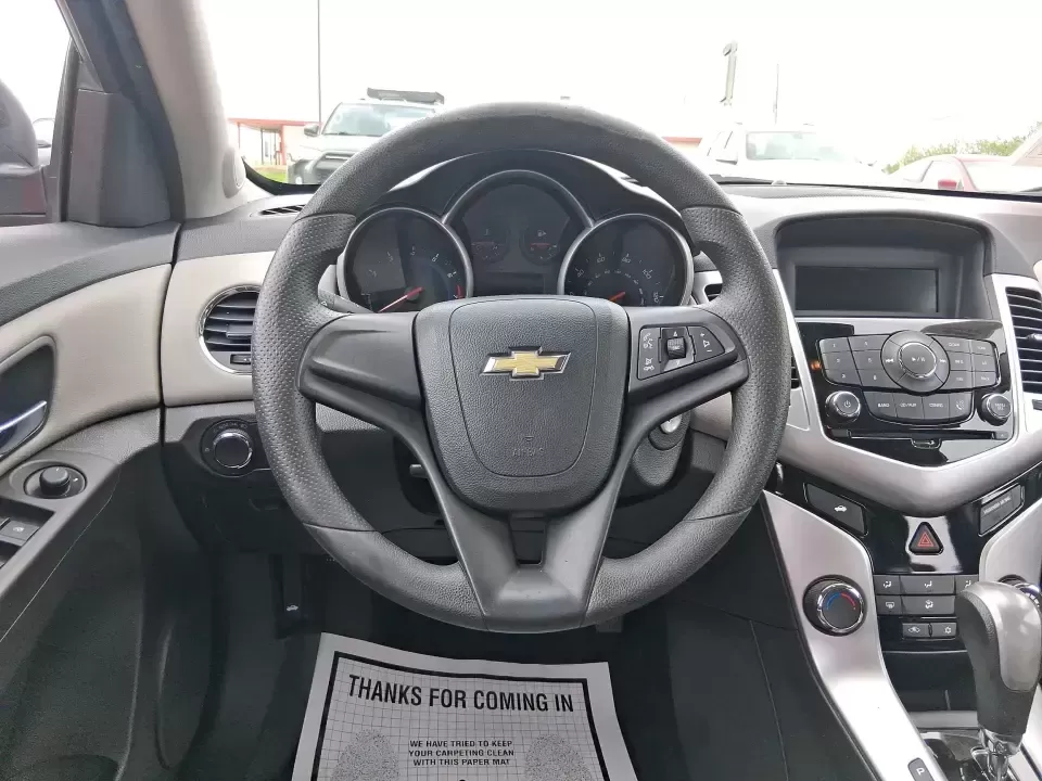 2015 Chevrolet Cruze LS Auto (1G1PA5SG9F7) with an ECOTEC 1.8L I-4 DOHC engine, 6-Speed Automatic transmission, located at 8750 N County Rd 25A, Piqua, OH, 45356, (937) 908-9800, 40.164391, -84.232513 - Picture an easy, affordable daily commute that still feels comfortable on I75, quick trips to downtown Piqua for dinner, and weekend errands that don't drain your budget at the pump. This 2015 Chevrolet Cruze LS Auto in eye-catching Red Hot is a smart, practical sedan for commuters, first-time buyer - Photo#16