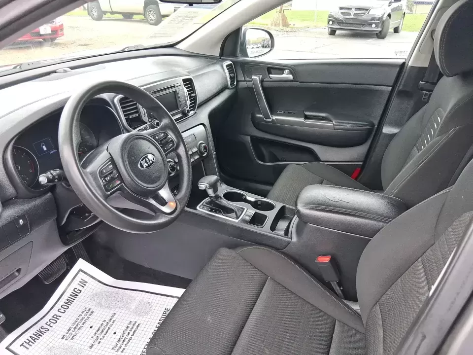 2018 Kia Sportage LX (KNDPM3AC0J7) with an Theta II 2.4L I-4 gasoline direct injection engine, 6A transmission, located at 1099 N County Rd 25A , Troy, OH, 45373, (937) 908-9800, 40.057079, -84.212883 - Weekend road trips to the Miami County Fair, daily commutes down I75, or quick errands between Downtown Troy and the shops near West Main Street-this 2018 Kia Sportage LX is the kind of compact SUV that fits real life. With its versatile crossover layout, confident road manners, and smart cargo spac - Photo#9