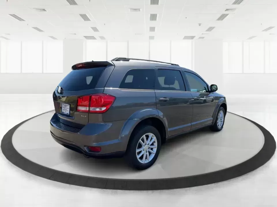 2014 Dodge Journey SXT (3C4PDDBG0ET) with an 3.6L V-6 DOHC engine, 6-Speed Automatic transmission, located at 1099 N County Rd 25A , Troy, OH, 45373, (937) 908-9800, 40.057079, -84.212883 - Pack up the kids, the dog, and the weekend bags-this 2014 Dodge Journey SXT is the kind of SUV that makes everyday life in Troy easier and spontaneous road trips feel completely doable. Whether you're tackling school drop-offs, commuting to Dayton, or planning a family day at the Miami County Fairgr - Photo#2