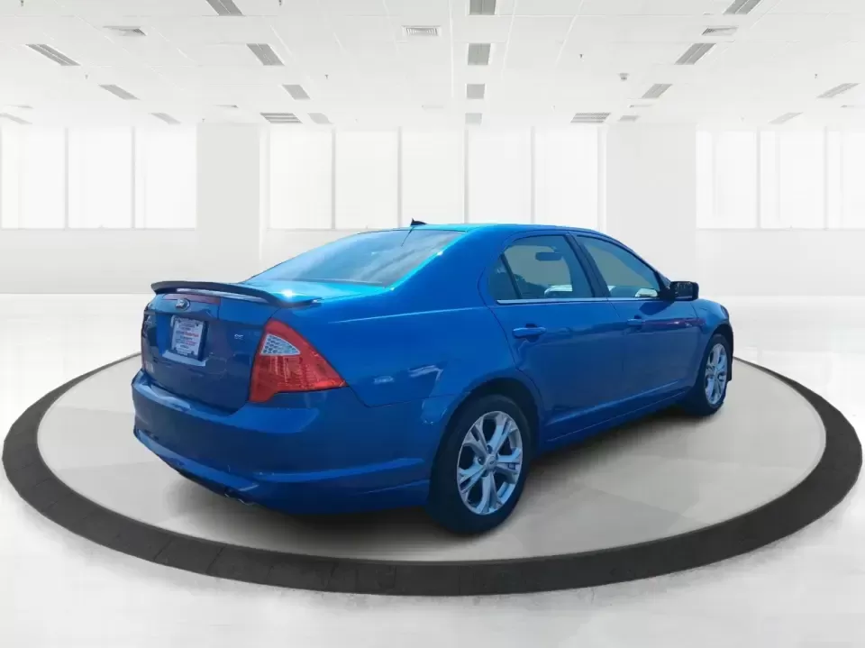 2012 Ford Fusion SE (3FAHP0HAXCR) with an 2.5L L4 DOHC 16V engine, located at 1099 N County Rd 25A , Troy, OH, 45373, (937) 908-9800, 40.057079, -84.212883 - Need a dependable sedan that makes everyday life easier-whether you're commuting down I-75 to Dayton, running errands around Troy, or planning a weekend drive past the Miami River and downtown's shops and festivals? This 2012 Ford Fusion SE in Blue Flame Metallic is a smart, comfortable choice for b - Photo#2