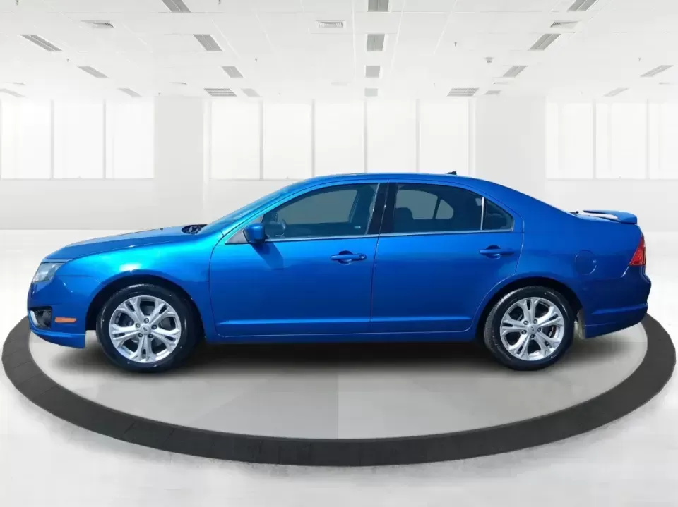 2012 Ford Fusion SE (3FAHP0HAXCR) with an 2.5L L4 DOHC 16V engine, located at 8750 N County Rd 25A, Piqua, OH, 45356, (937) 908-9800, 40.164391, -84.232513 - Need a dependable sedan that makes everyday life easier-whether you're commuting down I-75 to Dayton, running errands around Troy, or planning a weekend drive past the Miami River and downtown's shops and festivals? This 2012 Ford Fusion SE in Blue Flame Metallic is a smart, comfortable choice for b - Photo#5