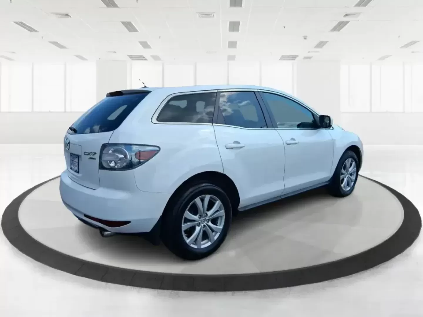 2010 Mazda CX-7 s Touring (JM3ER4W33A0) with an 2.3L I-4 gasoline direct injection engine, 6-Speed Automatic transmission, located at 8750 N County Rd 25A, Piqua, OH, 45356, (937) 908-9800, 40.164391, -84.232513 - Picture your next weekend: loading up the cargo area for a day at Miami County Park, cruising up I75 for a quick getaway, or confidently handling Ohio's surprise rain and winter slush on the school run. This 2010 Mazda CX7 s Touring is the kind of sporty, practical SUV that fits real life in Troy-ea - Photo#2