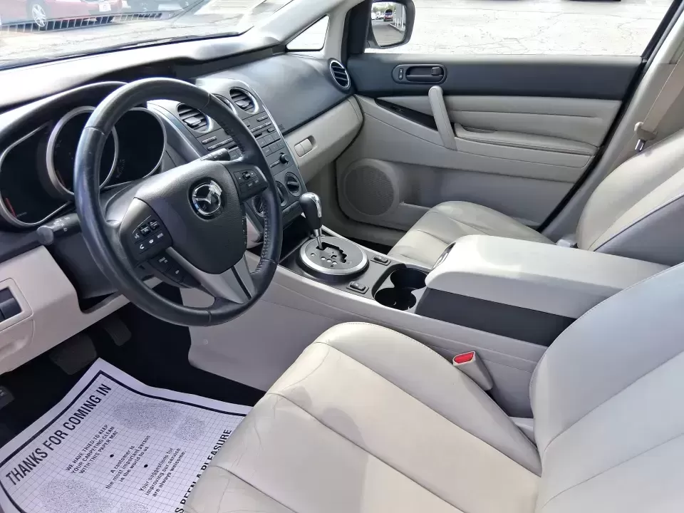 2010 Mazda CX-7 s Touring (JM3ER4W33A0) with an 2.3L I-4 gasoline direct injection engine, 6-Speed Automatic transmission, located at 1099 N County Rd 25A , Troy, OH, 45373, (937) 908-9800, 40.057079, -84.212883 - Picture your next weekend: loading up the cargo area for a day at Miami County Park, cruising up I75 for a quick getaway, or confidently handling Ohio's surprise rain and winter slush on the school run. This 2010 Mazda CX7 s Touring is the kind of sporty, practical SUV that fits real life in Troy-ea - Photo#9