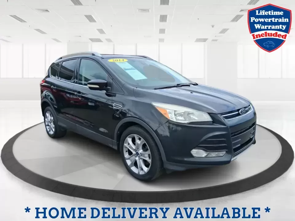 2014 Ford Escape Titanium (1FMCU9J99EU) with an 2.0L L4 DOHC 16V engine, 6-Speed Automatic transmission, located at 1099 N County Rd 25A , Troy, OH, 45373, (937) 908-9800, 40.057079, -84.212883 - Need one SUV that can handle an Ohio winter commute, school drop-offs, and a spontaneous weekend road trip to Hocking Hills without feeling like a compromise? This 2014 Ford Escape Titanium 4WD in sleek Tuxedo Black is built for real life in Troy-comfortable for long drives, confident in bad weather - Photo#0