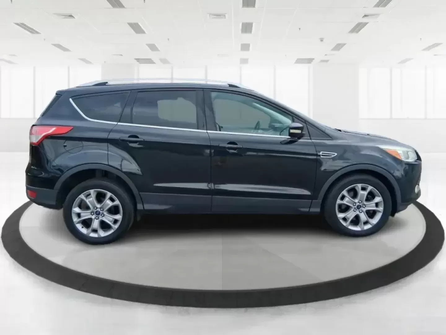 2014 Ford Escape Titanium (1FMCU9J99EU) with an 2.0L L4 DOHC 16V engine, 6-Speed Automatic transmission, located at 1099 N County Rd 25A , Troy, OH, 45373, (937) 908-9800, 40.057079, -84.212883 - Need one SUV that can handle an Ohio winter commute, school drop-offs, and a spontaneous weekend road trip to Hocking Hills without feeling like a compromise? This 2014 Ford Escape Titanium 4WD in sleek Tuxedo Black is built for real life in Troy-comfortable for long drives, confident in bad weather - Photo#1