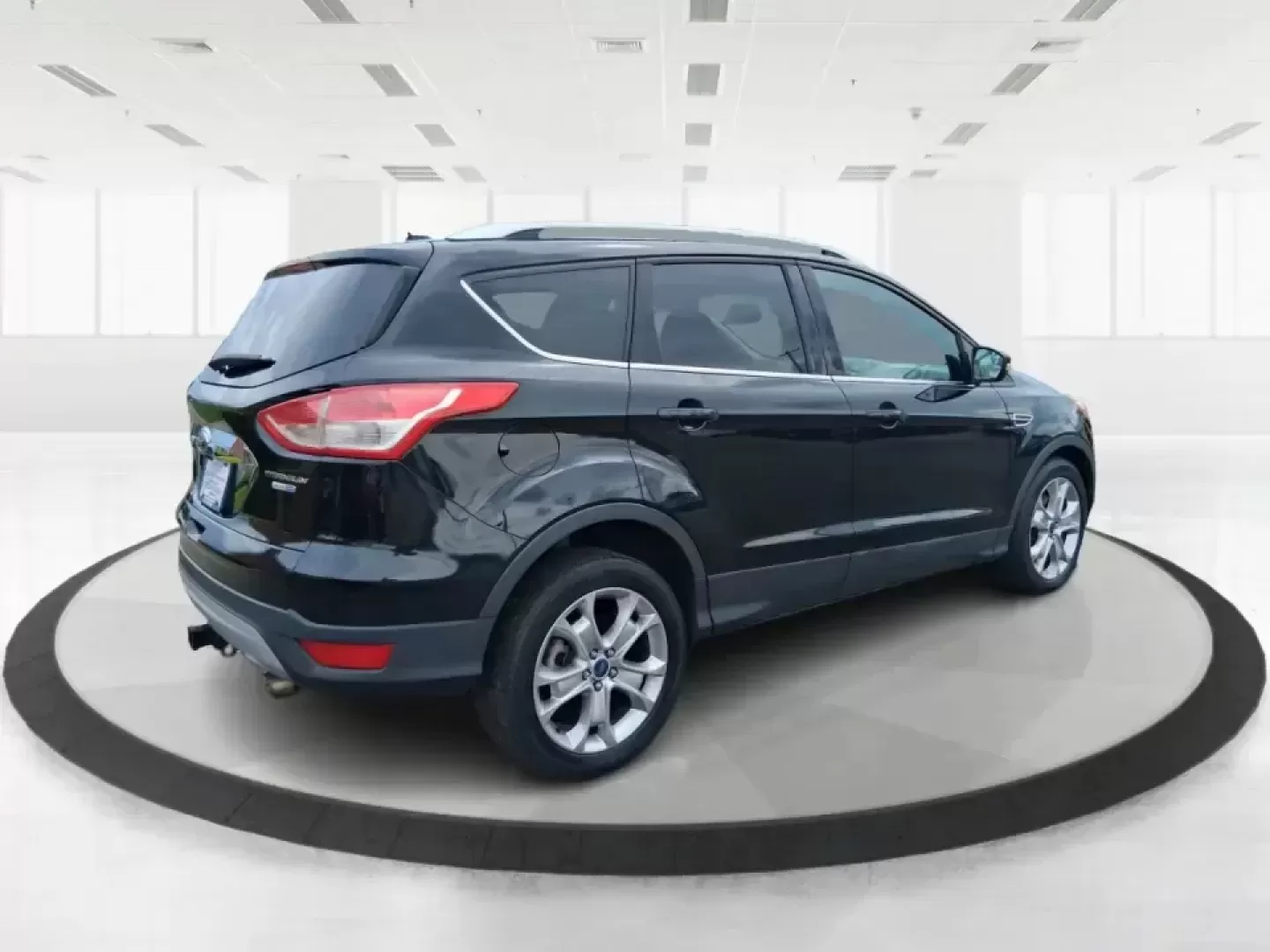 2014 Ford Escape Titanium (1FMCU9J99EU) with an 2.0L L4 DOHC 16V engine, 6-Speed Automatic transmission, located at 1099 N County Rd 25A , Troy, OH, 45373, (937) 908-9800, 40.057079, -84.212883 - Need one SUV that can handle an Ohio winter commute, school drop-offs, and a spontaneous weekend road trip to Hocking Hills without feeling like a compromise? This 2014 Ford Escape Titanium 4WD in sleek Tuxedo Black is built for real life in Troy-comfortable for long drives, confident in bad weather - Photo#2