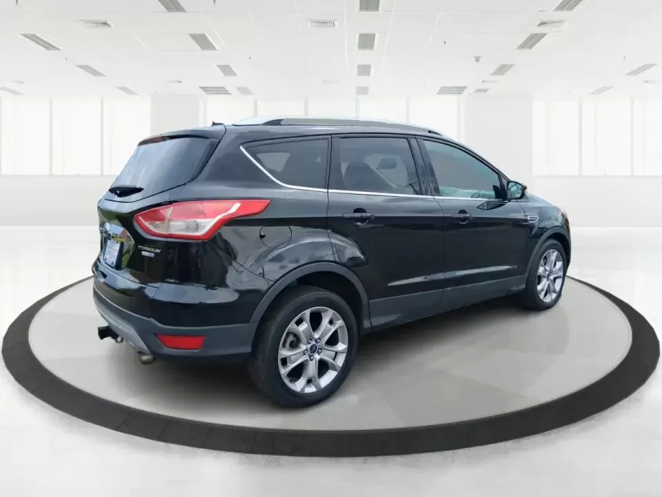 2014 Ford Escape Titanium (1FMCU9J99EU) with an 2.0L L4 DOHC 16V engine, 6-Speed Automatic transmission, located at 1099 N County Rd 25A , Troy, OH, 45373, (937) 908-9800, 40.057079, -84.212883 - Need one SUV that can handle an Ohio winter commute, school drop-offs, and a spontaneous weekend road trip to Hocking Hills without feeling like a compromise? This 2014 Ford Escape Titanium 4WD in sleek Tuxedo Black is built for real life in Troy-comfortable for long drives, confident in bad weather - Photo#2
