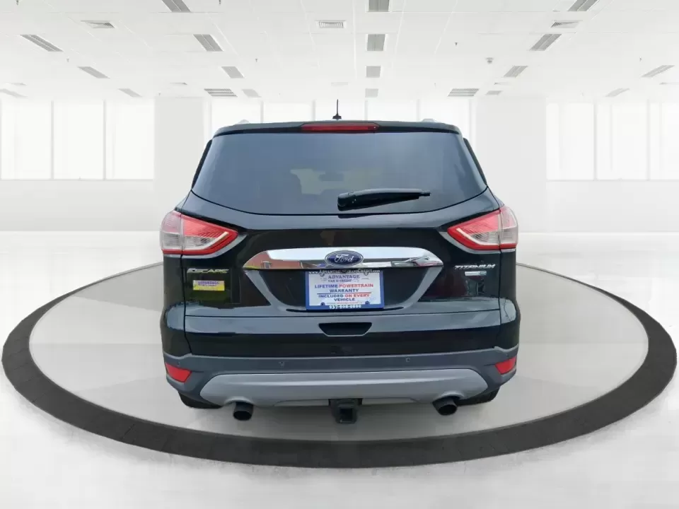 2014 Ford Escape Titanium (1FMCU9J99EU) with an 2.0L L4 DOHC 16V engine, 6-Speed Automatic transmission, located at 1099 N County Rd 25A , Troy, OH, 45373, (937) 908-9800, 40.057079, -84.212883 - Need one SUV that can handle an Ohio winter commute, school drop-offs, and a spontaneous weekend road trip to Hocking Hills without feeling like a compromise? This 2014 Ford Escape Titanium 4WD in sleek Tuxedo Black is built for real life in Troy-comfortable for long drives, confident in bad weather - Photo#3