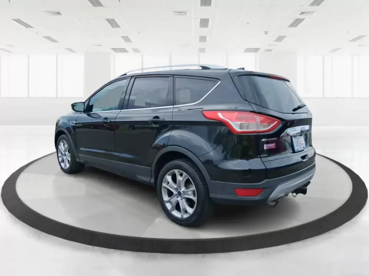 2014 Ford Escape Titanium (1FMCU9J99EU) with an 2.0L L4 DOHC 16V engine, 6-Speed Automatic transmission, located at 1099 N County Rd 25A , Troy, OH, 45373, (937) 908-9800, 40.057079, -84.212883 - Need one SUV that can handle an Ohio winter commute, school drop-offs, and a spontaneous weekend road trip to Hocking Hills without feeling like a compromise? This 2014 Ford Escape Titanium 4WD in sleek Tuxedo Black is built for real life in Troy-comfortable for long drives, confident in bad weather - Photo#4