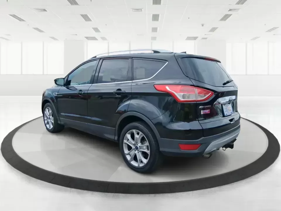 2014 Ford Escape Titanium (1FMCU9J99EU) with an 2.0L L4 DOHC 16V engine, 6-Speed Automatic transmission, located at 1099 N County Rd 25A , Troy, OH, 45373, (937) 908-9800, 40.057079, -84.212883 - Need one SUV that can handle an Ohio winter commute, school drop-offs, and a spontaneous weekend road trip to Hocking Hills without feeling like a compromise? This 2014 Ford Escape Titanium 4WD in sleek Tuxedo Black is built for real life in Troy-comfortable for long drives, confident in bad weather - Photo#4