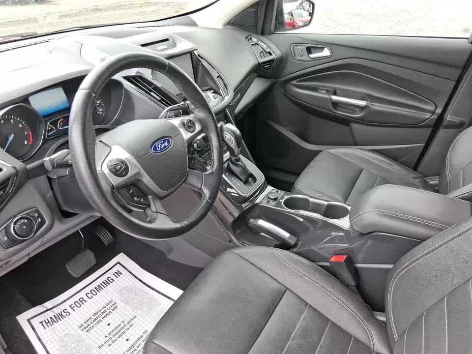 2014 Ford Escape Titanium (1FMCU9J99EU) with an 2.0L L4 DOHC 16V engine, 6-Speed Automatic transmission, located at 1099 N County Rd 25A , Troy, OH, 45373, (937) 908-9800, 40.057079, -84.212883 - Need one SUV that can handle an Ohio winter commute, school drop-offs, and a spontaneous weekend road trip to Hocking Hills without feeling like a compromise? This 2014 Ford Escape Titanium 4WD in sleek Tuxedo Black is built for real life in Troy-comfortable for long drives, confident in bad weather - Photo#9