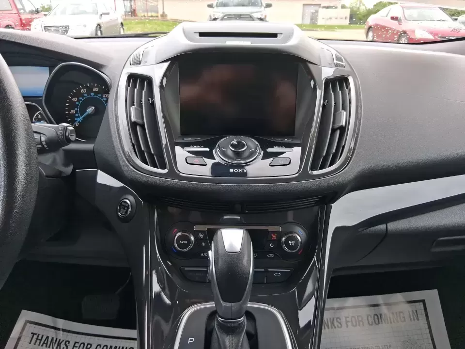 2014 Ford Escape Titanium (1FMCU9J99EU) with an 2.0L L4 DOHC 16V engine, 6-Speed Automatic transmission, located at 1099 N County Rd 25A , Troy, OH, 45373, (937) 908-9800, 40.057079, -84.212883 - Need one SUV that can handle an Ohio winter commute, school drop-offs, and a spontaneous weekend road trip to Hocking Hills without feeling like a compromise? This 2014 Ford Escape Titanium 4WD in sleek Tuxedo Black is built for real life in Troy-comfortable for long drives, confident in bad weather - Photo#13