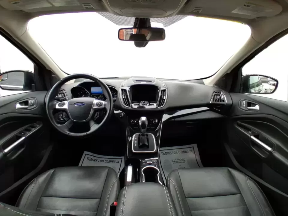 2014 Ford Escape Titanium (1FMCU9J99EU) with an 2.0L L4 DOHC 16V engine, 6-Speed Automatic transmission, located at 1099 N County Rd 25A , Troy, OH, 45373, (937) 908-9800, 40.057079, -84.212883 - Need one SUV that can handle an Ohio winter commute, school drop-offs, and a spontaneous weekend road trip to Hocking Hills without feeling like a compromise? This 2014 Ford Escape Titanium 4WD in sleek Tuxedo Black is built for real life in Troy-comfortable for long drives, confident in bad weather - Photo#21