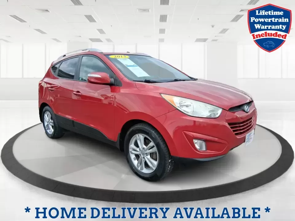 2013 Hyundai Tucson GLS (KM8JUCAC7DU) with an Theta II 2.4L I-4 DOHC engine, 6-Speed Automatic transmission, located at 1951 S Dayton Lakeview Rd., New Carlisle, OH, 45344, (937) 908-9800, 39.890999, -84.050255 - Need a dependable SUV that can handle Ohio weather, school drop-offs, and weekend getaways without stretching your budget? This 2013 Hyundai Tucson GLS in eye-catching Garnet Red is built for real life-comfortable for daily commuting, confident on slick winter roads, and practical for everything fro - Photo#0